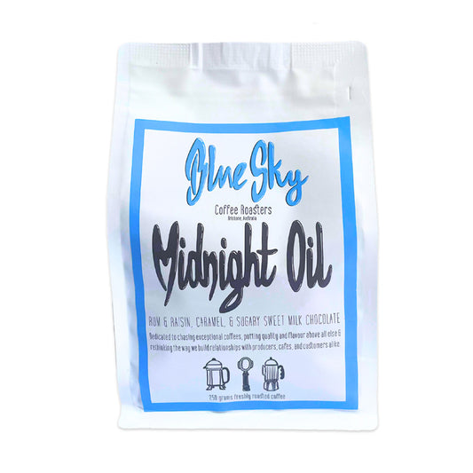 Coffee bag labeled 'Blue Sky Coffee Roasters Midnight Oil' on a white background